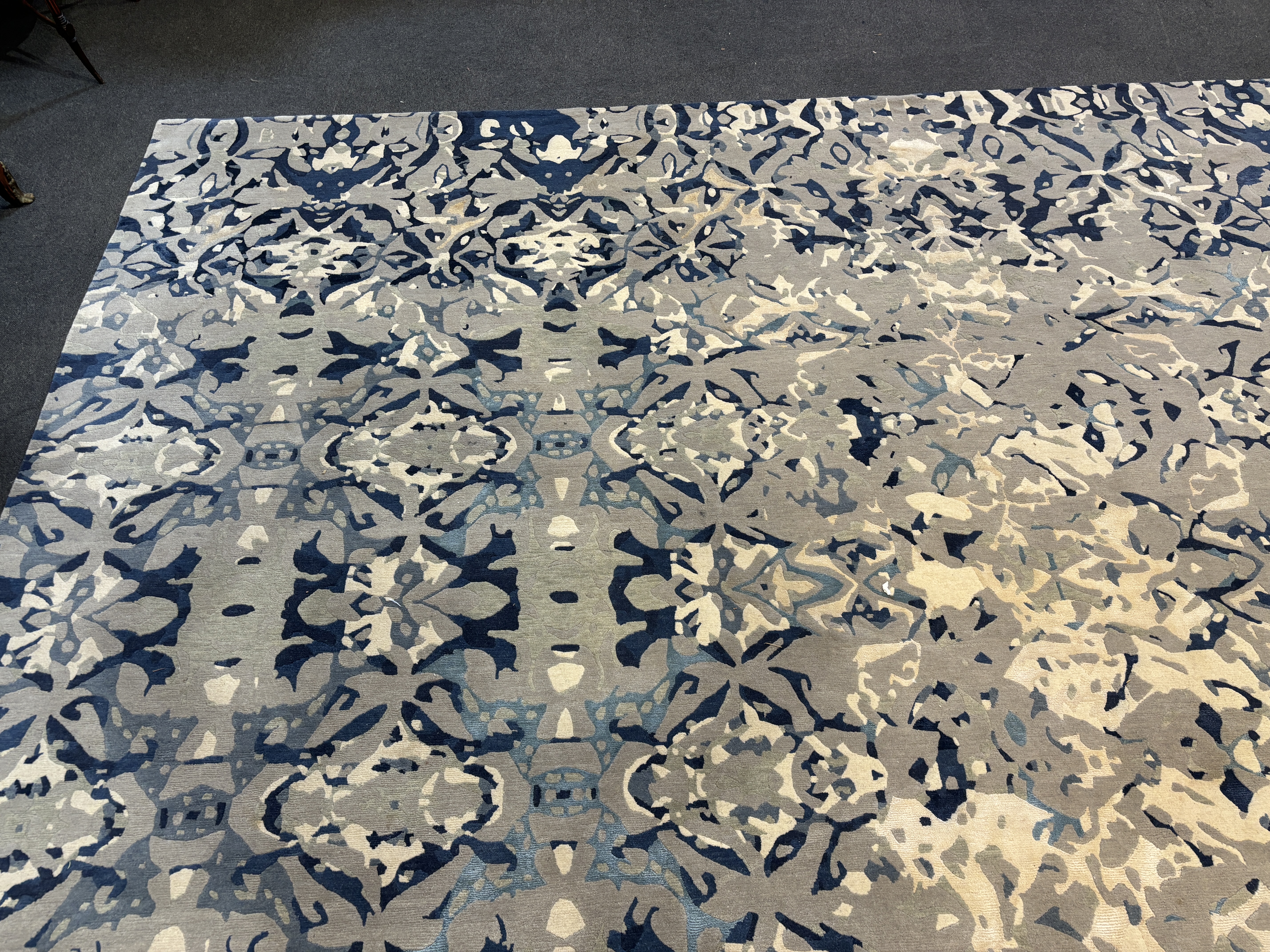 An Elizabeth Ashard 'Moghul', a silk and wool blue tones pattern carpet, 665 x 440cm